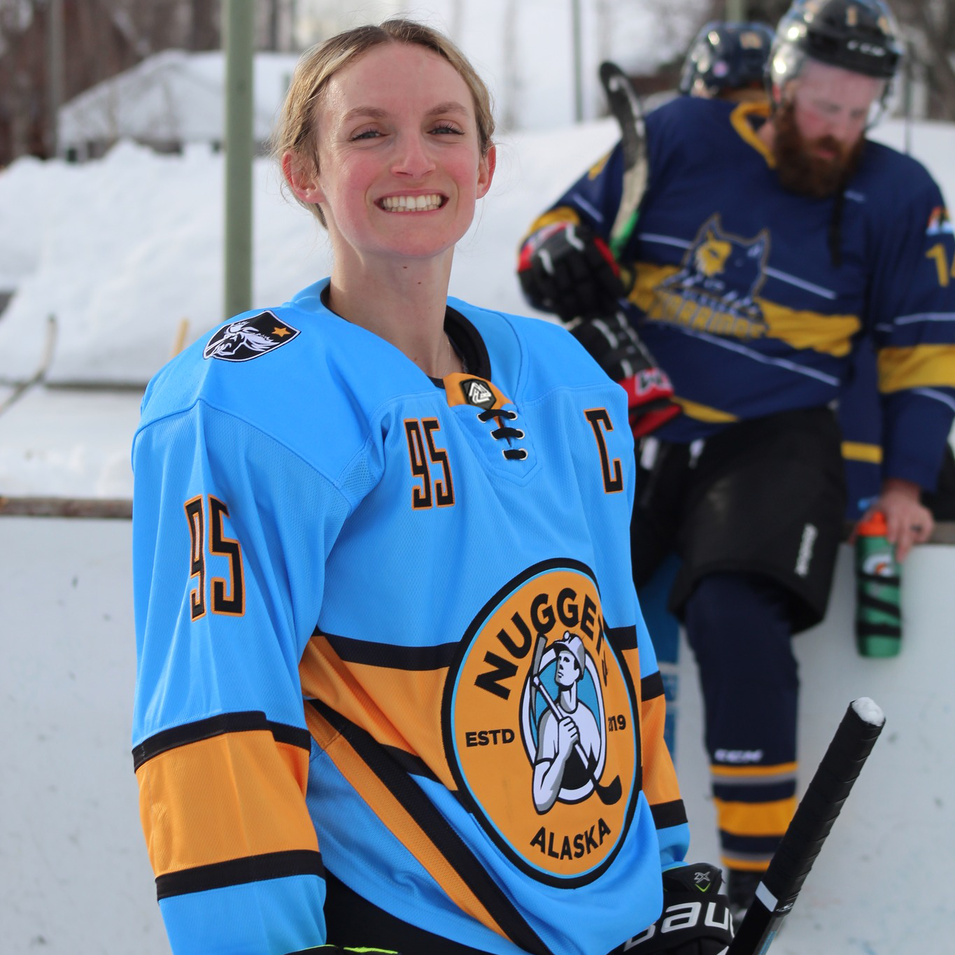 Woman hockey player in custom embroidered hockey jersey by Hyperco Sports