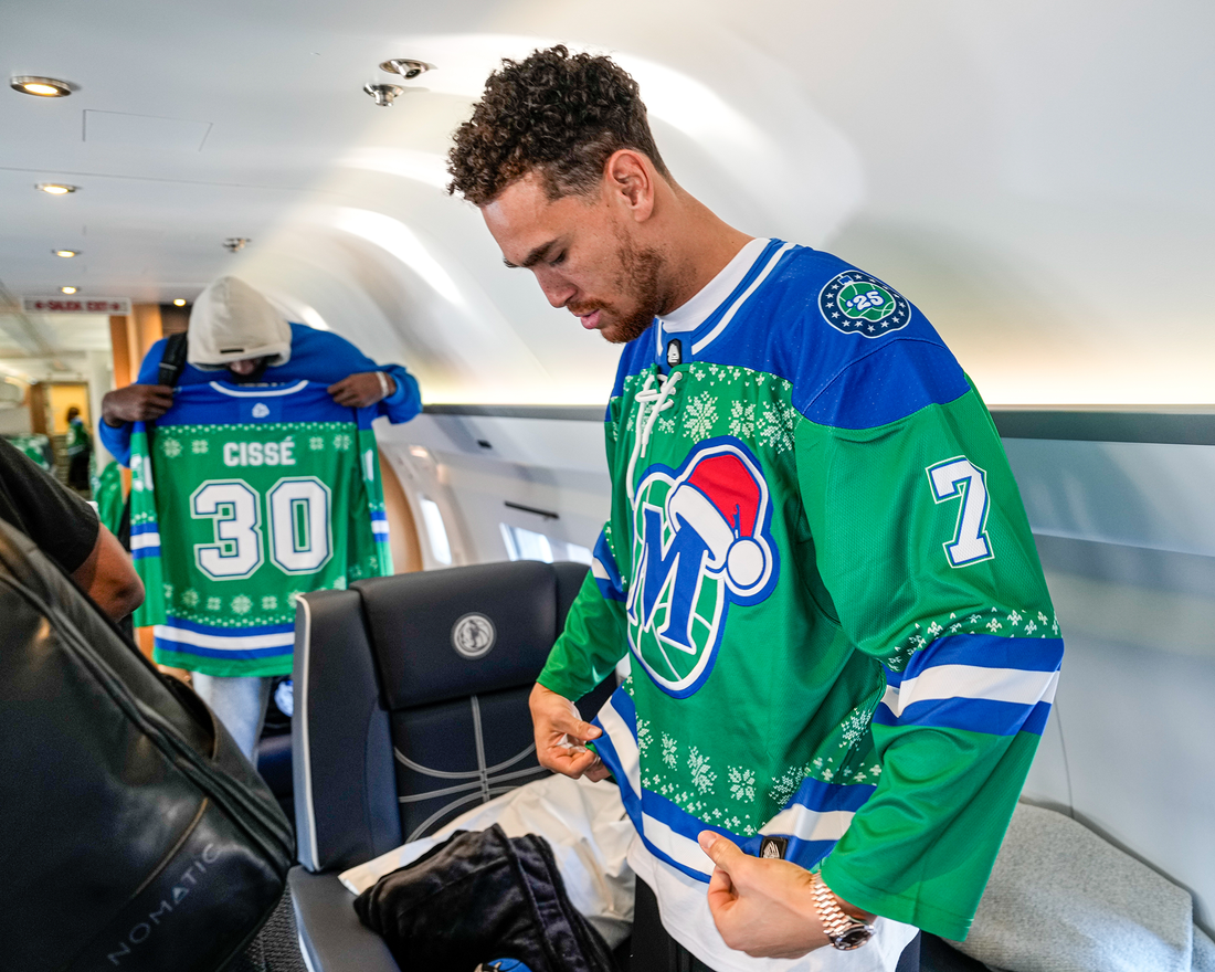 Dwight Powell of the Dallas Mavericks wearing a custom hockey jersey from Hyperco Sports