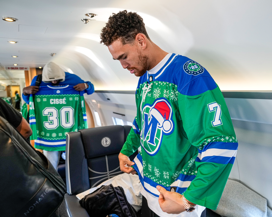 Dwight Powell of the Dallas Mavericks wearing a custom hockey jersey from Hyperco Sports