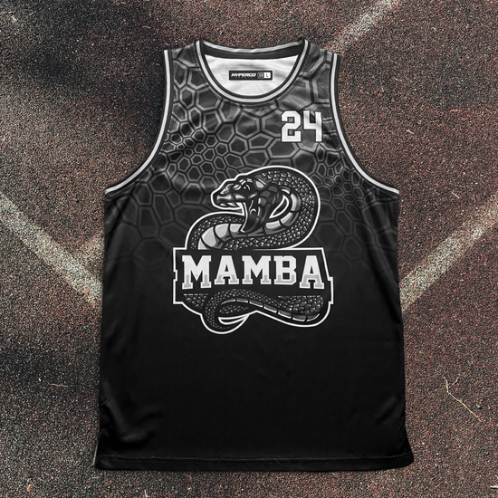Black basketball jersey with snake design and 'Mamba' text on a textured surface