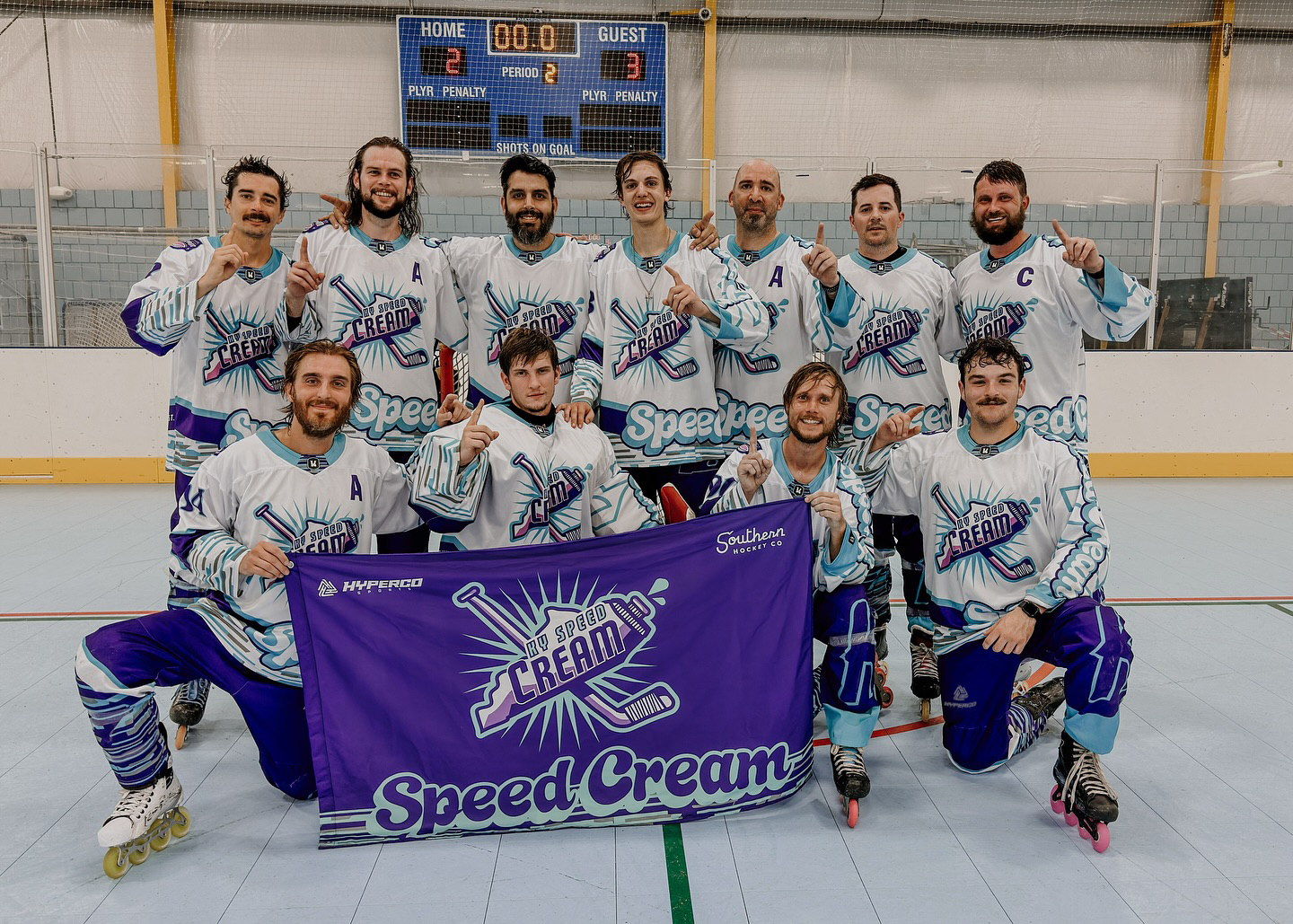 Custom inline roller hockey uniforms and team flag by Hyperco Sports